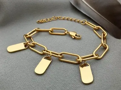 Сталевий браслет з підвісками