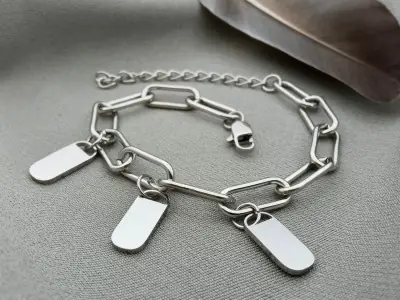 Сталевий браслет з підвісками